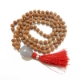 Show details for  Rudraksha Mala mit facettiertem Trommelanhänger aus blauem Chalcedon Picture of  Rudraksha Mala mit facettiertem Trommelanhänger aus blauem Chalcedon